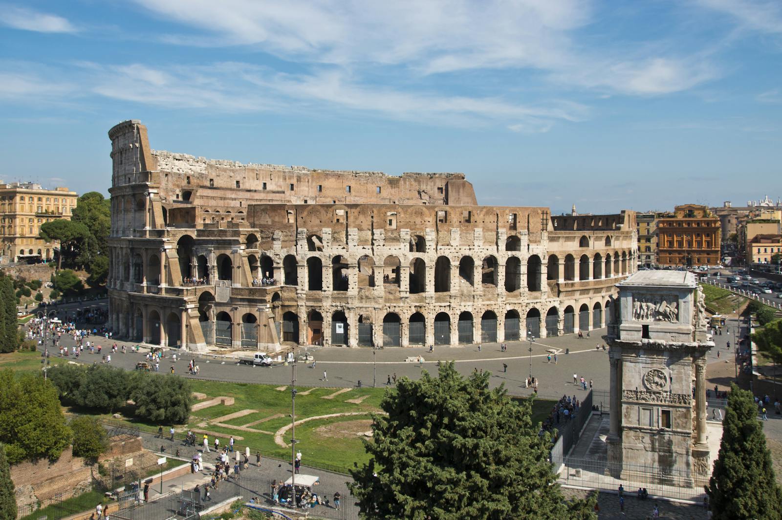 Aerial view of the Colosseum under a blue sky